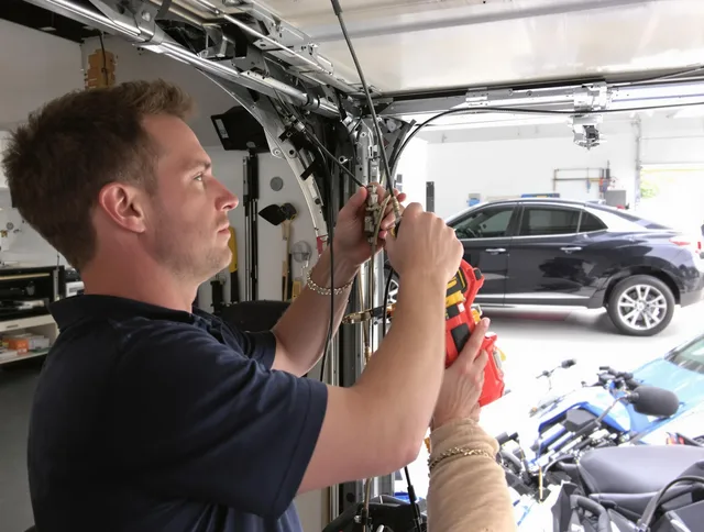 Lauderhill Garage Door Repair safety certified technician performing cable replacement in Lauderhill