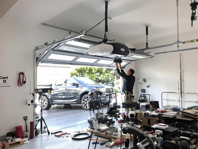 Lauderhill Garage Door Repair specialist installing smart garage door opener system in Lauderhill home