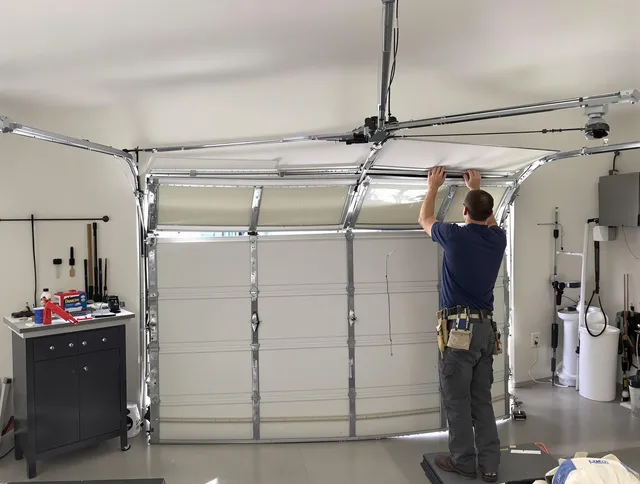 Lauderhill Garage Door Repair specialist performing precise section replacement on Lauderhill garage door